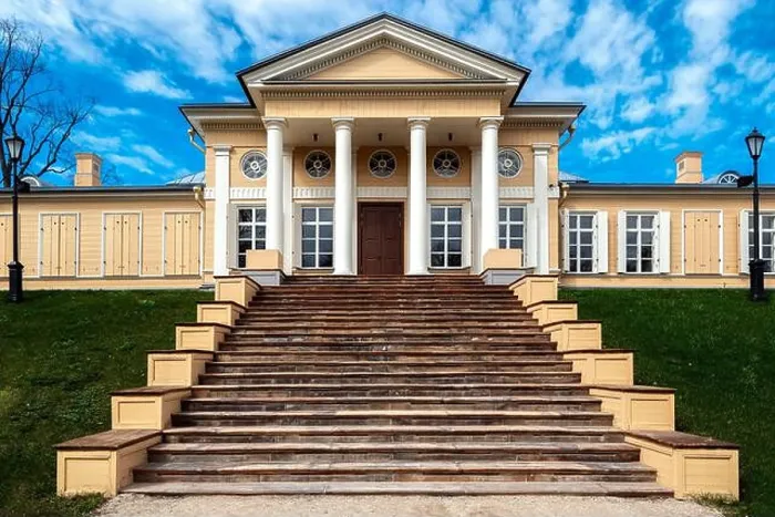 Framed Print : Wooden house with white columns and a wide staircase with stone steps leading to it Framed Print : Wooden house with white columns and a wide staircase with stone steps leading to it