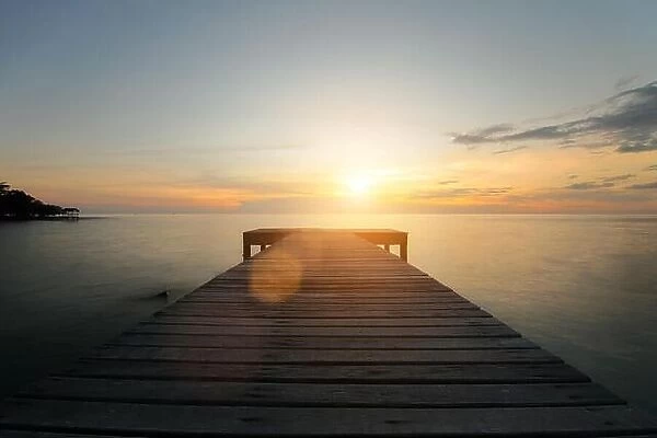 Wooden pier between sunset in Phuket, Thailand. Summer, Travel, Vacation and Holiday concept