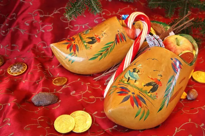 Framed Print : Wooden Shoes on a red background ready for St Nick Framed Print : Wooden Shoes on a red background ready for St Nick