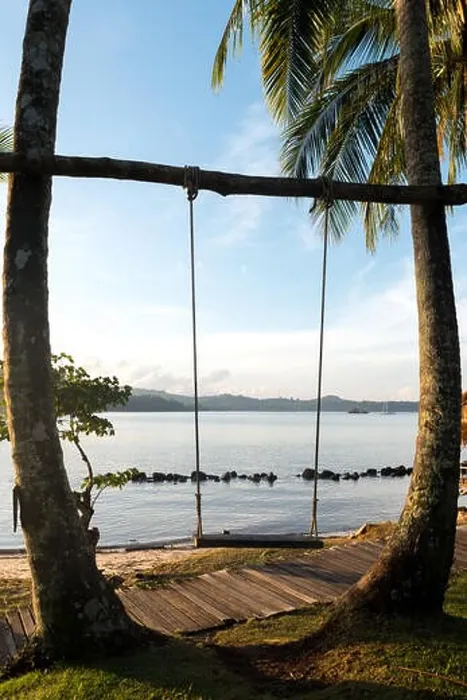 Framed Print : Wooden swing chair hanging on tree near beach at island in Phuket, Thailand. Summer Vacation Travel and Holiday concept Framed Print : Wooden swing chair hanging on tree near beach at island in Phuket, Thailand. Summer Vacation Travel and Holiday concept