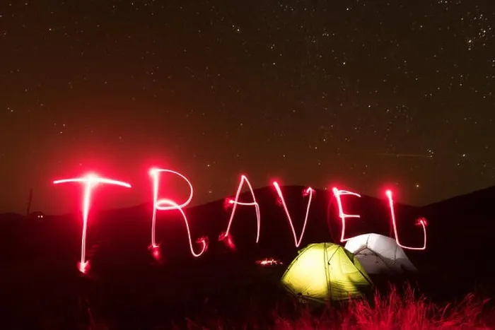 Framed Print : Word 2020 written by a red luminous flashlight near lighted from the inside tents against the backdrop of an incredible mountains landscape. Tourism c Framed Print : Word 2020 written by a red luminous flashlight near lighted from the inside tents against the backdrop of an incredible mountains landscape. Tourism c