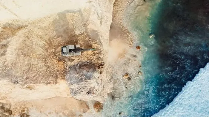 Framed Print : The work of escalators and the destroying of the cliff in Uluwatu, Bali. Aerial view, top down Framed Print : The work of escalators and the destroying of the cliff in Uluwatu, Bali. Aerial view, top down