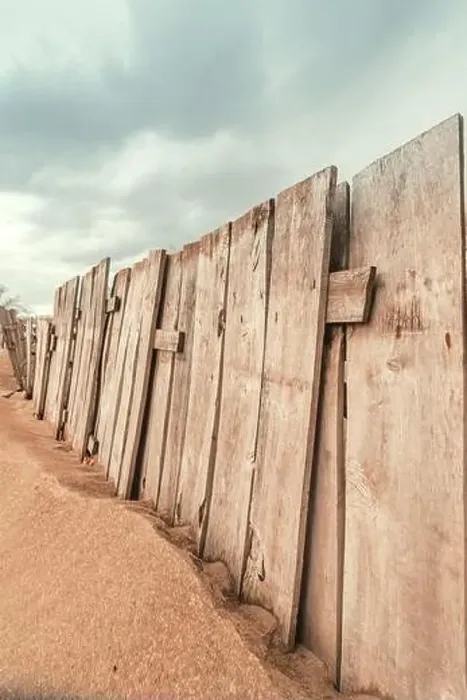 Framed Print : Worn wooden fence on sandy beach, vertical image selective focus Framed Print : Worn wooden fence on sandy beach, vertical image selective focus