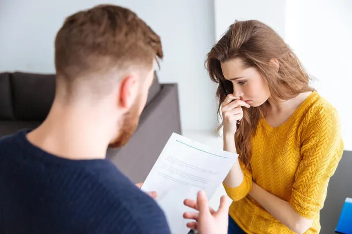 Framed Print : Worried couple discussing about domestic finances at home Framed Print : Worried couple discussing about domestic finances at home