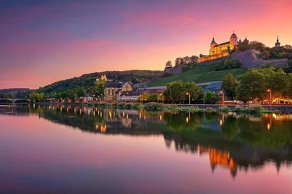 Wurzburg, Germany. Cityscape image of Wurzburg with Marienberg Fortress and reflection of the city in Main Rive during beautiful sunset