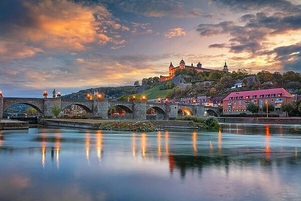 Wurzburg, Germany. Cityscape image of Wurzburg with Old Main Bridge over Main river and Marienberg Fortress during beautiful autumn sunset