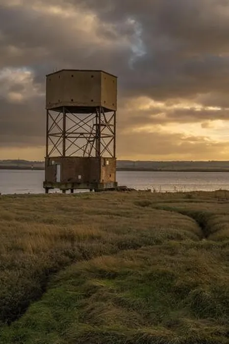 Framed Print : WW2 radar control building disguised as a water tower on the edge of the River Thames at Coalhouse Fort Essex at sunset