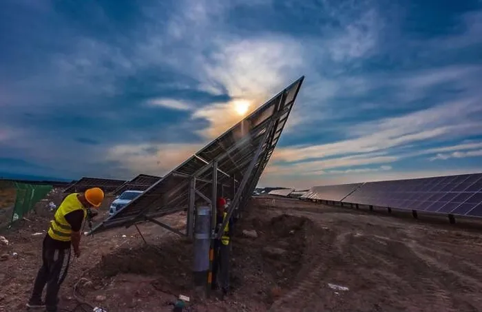 Framed Print : XINJIANG, CHINA - SEPTEMBER 30, 2024 - A worker checks a photovoltaic panel in Xinjiang, China, September 30, 2024 Framed Print : XINJIANG, CHINA - SEPTEMBER 30, 2024 - A worker checks a photovoltaic panel in Xinjiang, China, September 30, 2024