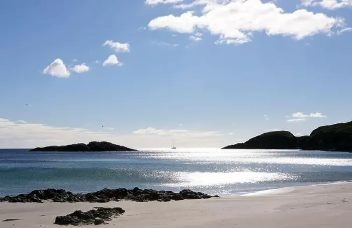Framed Print : Yacht passing Scoor beach, a secluded sandy beach, on the Ross of Mull, Isle of Mull, Scotland UK Framed Print : Yacht passing Scoor beach, a secluded sandy beach, on the Ross of Mull, Isle of Mull, Scotland UK