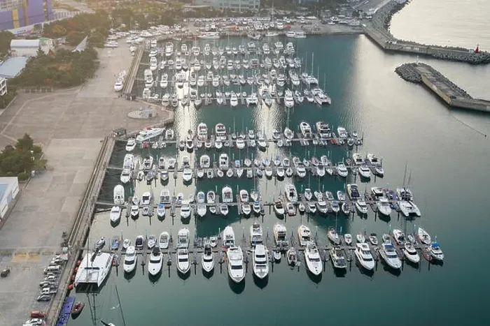 Framed Print : Yatch harbor marina pier and boat dock yatchs and vessels awaiting the open sea. Aerial drone view looking straight down above T-Head Framed Print : Yatch harbor marina pier and boat dock yatchs and vessels awaiting the open sea. Aerial drone view looking straight down above T-Head