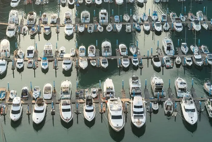 Framed Print : Yatch harbor marina pier and boat dock yatchs and vessels awaiting the open sea. Aerial drone view looking straight down above T-Head Framed Print : Yatch harbor marina pier and boat dock yatchs and vessels awaiting the open sea. Aerial drone view looking straight down above T-Head