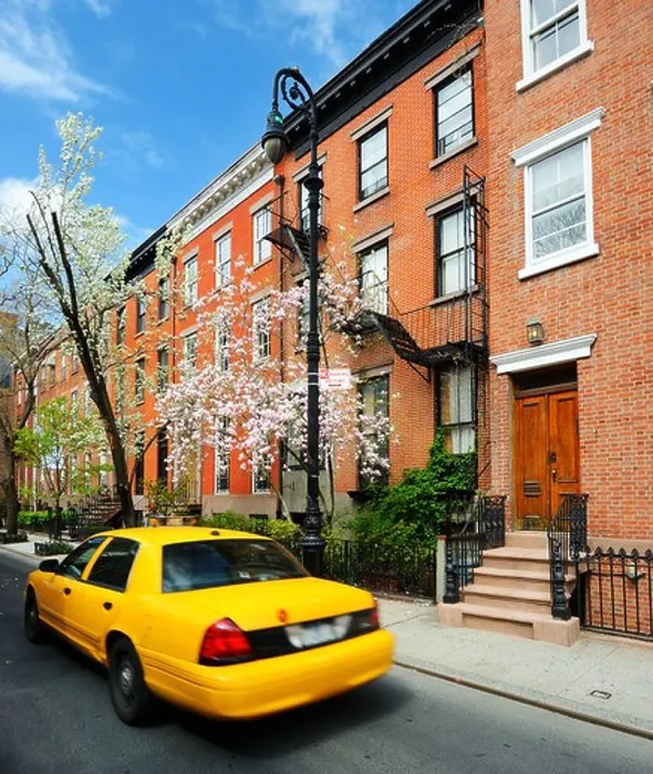 Framed Print : Yellowcab passes by Greenwich Village apartments in New York City Framed Print : Yellowcab passes by Greenwich Village apartments in New York City