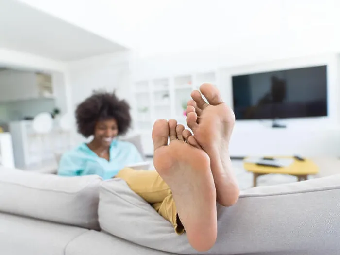 Framed Print : Young african american woman at home relaxing in her luxury lliving room reading a digital tablet surf internet Framed Print : Young african american woman at home relaxing in her luxury lliving room reading a digital tablet surf internet