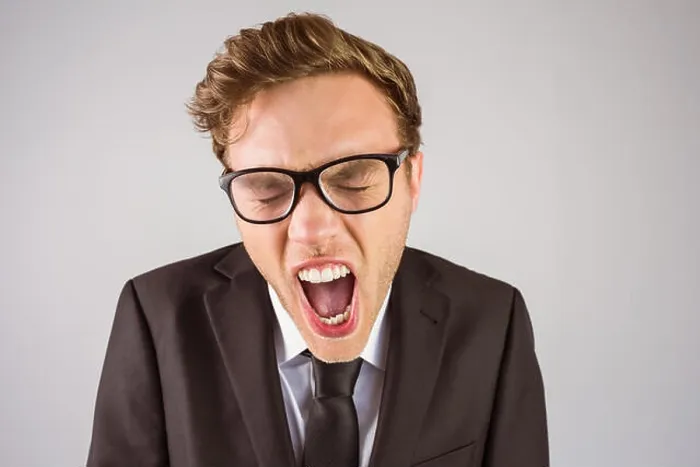 Framed Print : Young angry businessman shouting at camera Framed Print : Young angry businessman shouting at camera