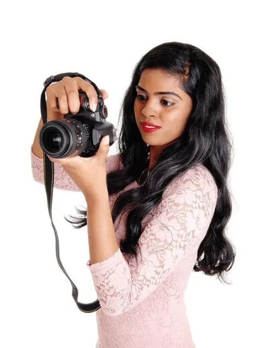 Framed Print : A young beautiful Indian women taking pictures with a DLS camera, isolated for white background Framed Print : A young beautiful Indian women taking pictures with a DLS camera, isolated for white background