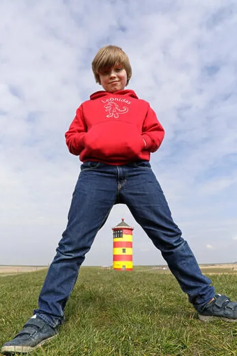 Framed Print : young boy standing straddle-legged in front of Pilsum Lighthouse, East Friesland, Lower Saxony, Germany Framed Print : young boy standing straddle-legged in front of Pilsum Lighthouse, East Friesland, Lower Saxony, Germany