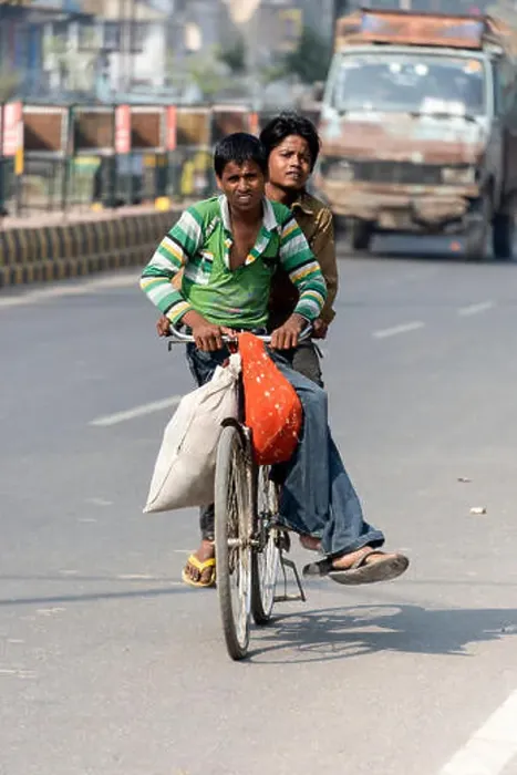 Framed Print : Two young boys riding on a bicycle on the main road in Agra, Uttar Pradesh.India Framed Print : Two young boys riding on a bicycle on the main road in Agra, Uttar Pradesh.India