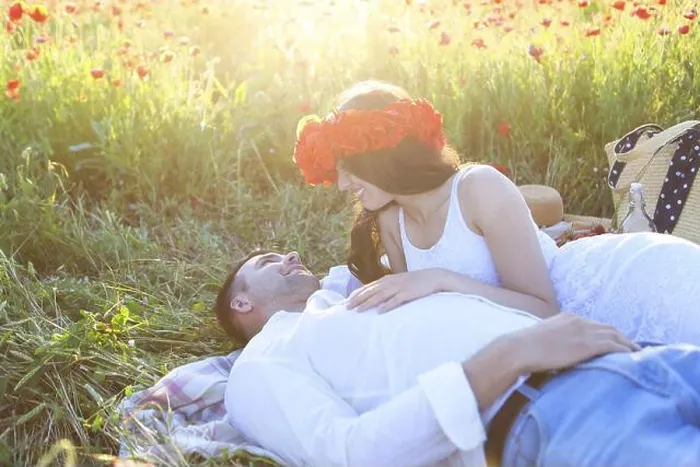 Framed Print : Young couple in love kissing and hugging at poppy field Framed Print : Young couple in love kissing and hugging at poppy field
