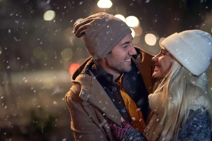 Framed Print : A young couple in romantic moments on a magical night on a snowy weather in the city. Love, together, walk, snow, city Framed Print : A young couple in romantic moments on a magical night on a snowy weather in the city. Love, together, walk, snow, city