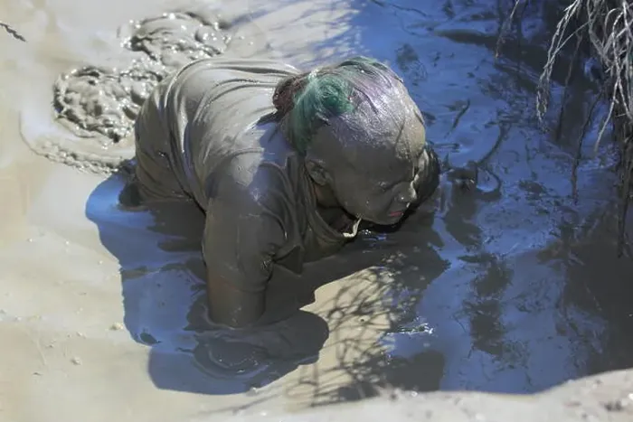Framed Print : A young girl is covered from head to toe in mud, after participating in a muddy obstacle event Framed Print : A young girl is covered from head to toe in mud, after participating in a muddy obstacle event
