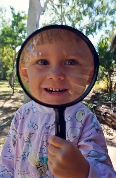 Framed Print : Young girl with magnifying ^glass Framed Print : Young girl with magnifying ^glass
