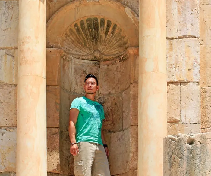 Framed Print : Young man posing as a statue in the Roman ruins of Jerash, Jordan Framed Print : Young man posing as a statue in the Roman ruins of Jerash, Jordan