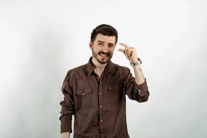 Framed Print : Young man smiling confident wearing casual clothes posing isolated over white background looking at camera showing