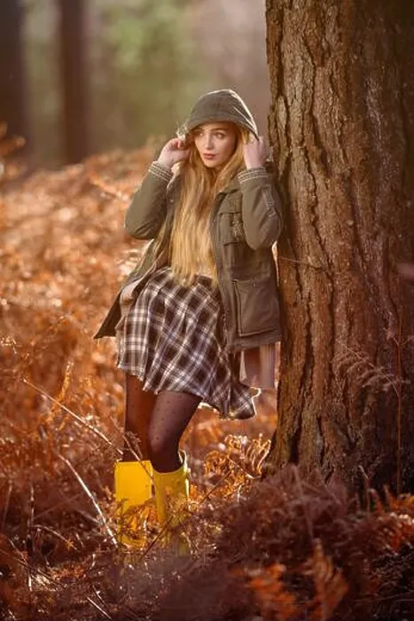 Framed Print : Young naturally beautiful women in a forest setting with orange autumnal winter hues wearing a green coat with the hood Framed Print : Young naturally beautiful women in a forest setting with orange autumnal winter hues wearing a green coat with the hood
