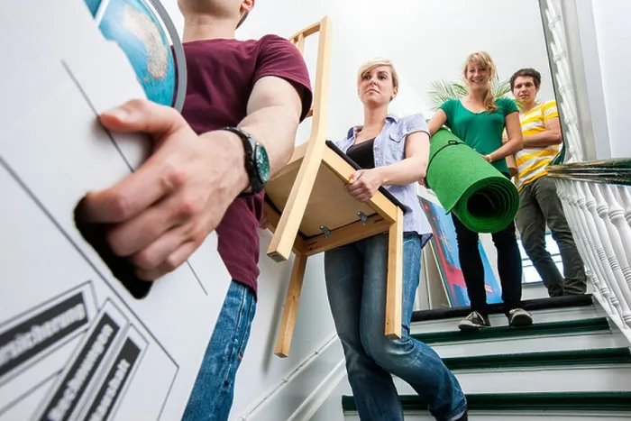 Framed Print : Young people moving in to a new apartment Framed Print : Young people moving in to a new apartment