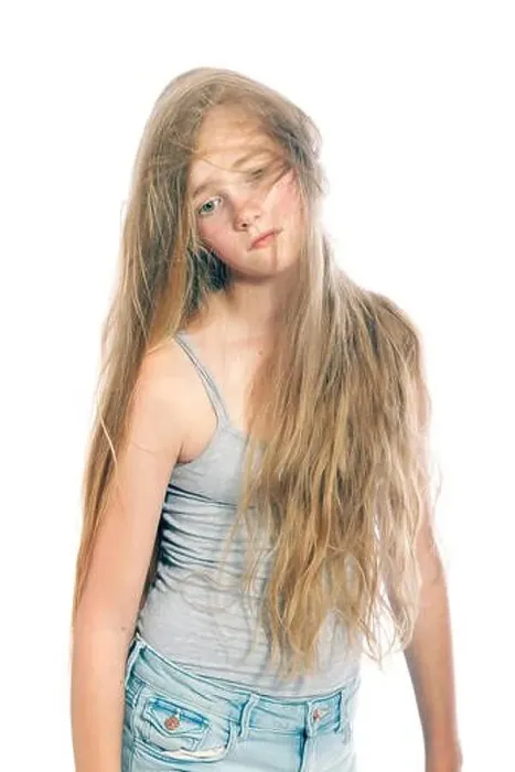 Framed Print : young and sad teen girl hides behind blond wavy hair against white studio background Framed Print : young and sad teen girl hides behind blond wavy hair against white studio background