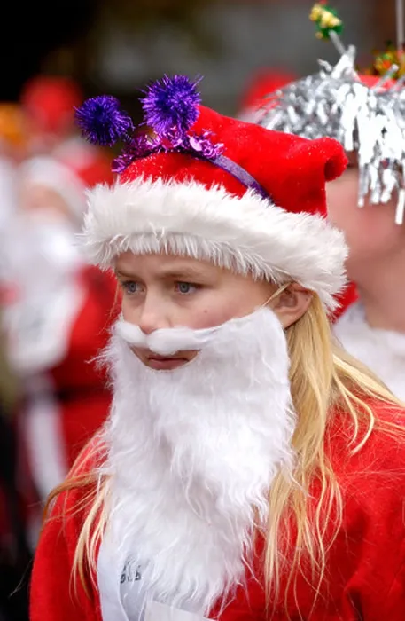 Framed Print : Young woman dressed as Santa Claus for the annual charity Santa Fun Run at Newtown Powys Wales UK Framed Print : Young woman dressed as Santa Claus for the annual charity Santa Fun Run at Newtown Powys Wales UK