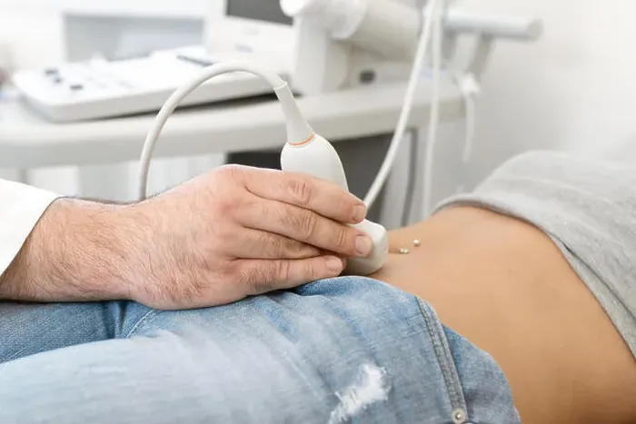 Framed Print : Young woman having 4D ultrasound scan. Ultrasound imaging, examination of the abdomen Framed Print : Young woman having 4D ultrasound scan. Ultrasound imaging, examination of the abdomen