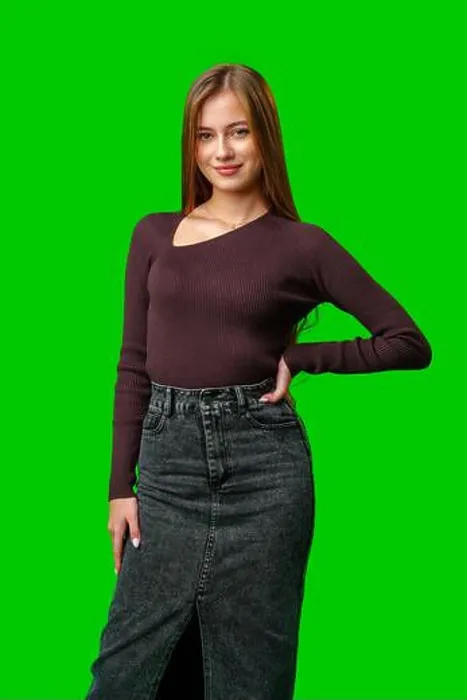 Framed Print : Young Woman Wearing a Brown Sweater and Denim Skirt Against Green Screen Framed Print : Young Woman Wearing a Brown Sweater and Denim Skirt Against Green Screen