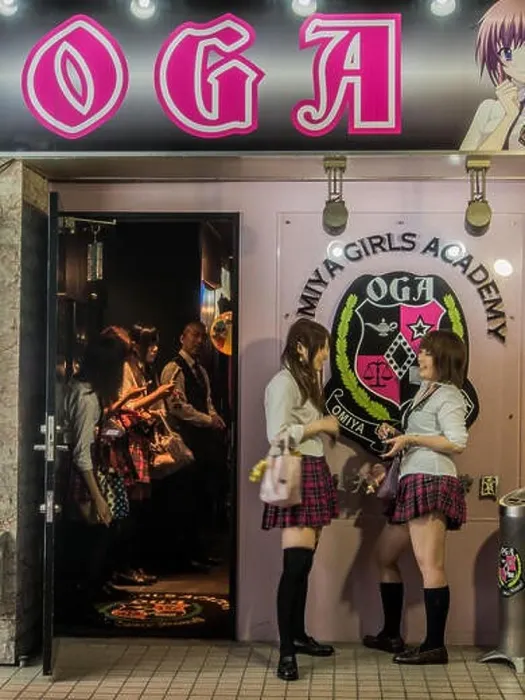 Framed Print : Young women in school girl uniform chat as they wait for clients outside hostess club with schoolgirl theme, red light district, Omiya, Saitama Japan Framed Print : Young women in school girl uniform chat as they wait for clients outside hostess club with schoolgirl theme, red light district, Omiya, Saitama Japan
