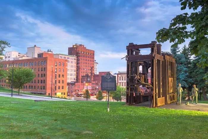 Framed Print : YOUNGSTOWN, OHIO - AUGUST 7, 2019: Downtown Youngstown with the Little Steel Strike of 1937 monument and memorial at twilight Framed Print : YOUNGSTOWN, OHIO - AUGUST 7, 2019: Downtown Youngstown with the Little Steel Strike of 1937 monument and memorial at twilight