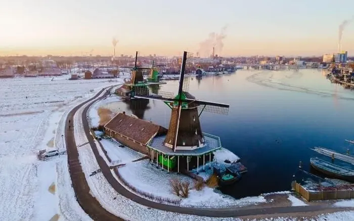 Framed Print : Zaanse Schans windmill village during winter with snow landscape in the Netherlands Holland village in winter Framed Print : Zaanse Schans windmill village during winter with snow landscape in the Netherlands Holland village in winter