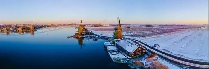 Framed Print : Zaanse Schans windmill village during winter with snow landscape in the Netherlands Holland village in winter Framed Print : Zaanse Schans windmill village during winter with snow landscape in the Netherlands Holland village in winter