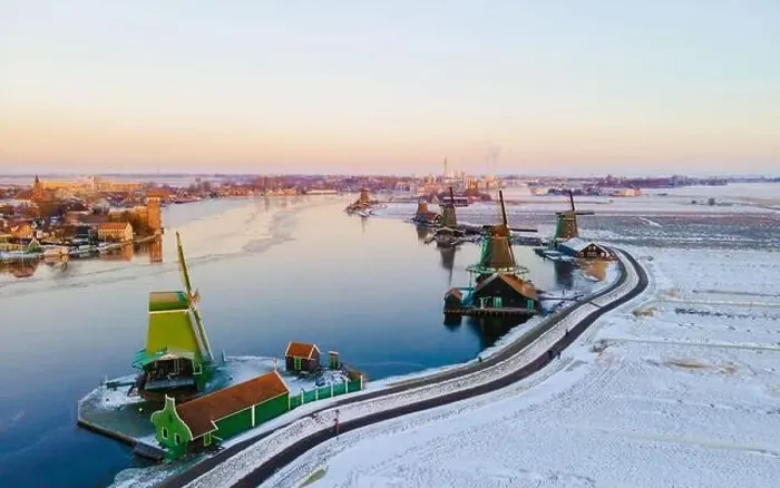 Framed Print : Zaanse Schans windmill village during winter with snow landscape in the Netherlands Holland village in winter Framed Print : Zaanse Schans windmill village during winter with snow landscape in the Netherlands Holland village in winter