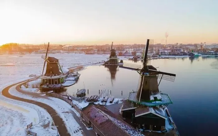 Framed Print : Zaanse Schans windmill village during winter with snow landscape in the Netherlands Holland village in winter