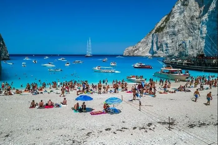 Framed Print : Zakynthos, Greece - August 20, 2019: Aerial drone shot of tourists on Zakynthos Shipwreck Navagio beach Framed Print : Zakynthos, Greece - August 20, 2019: Aerial drone shot of tourists on Zakynthos Shipwreck Navagio beach