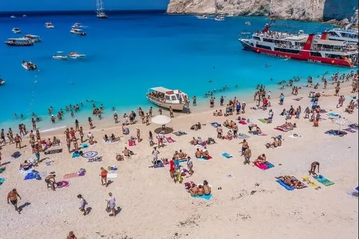 Framed Print : Zakynthos, Greece - August 20, 2019: Aerial drone shot of tourists on Zakynthos Shipwreck Navagio beach Framed Print : Zakynthos, Greece - August 20, 2019: Aerial drone shot of tourists on Zakynthos Shipwreck Navagio beach