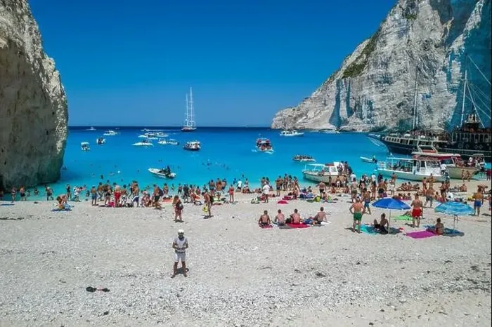 Framed Print : Zakynthos, Greece - August 20, 2019: Aerial drone shot of tourists on Zakynthos Shipwreck Navagio beach Framed Print : Zakynthos, Greece - August 20, 2019: Aerial drone shot of tourists on Zakynthos Shipwreck Navagio beach