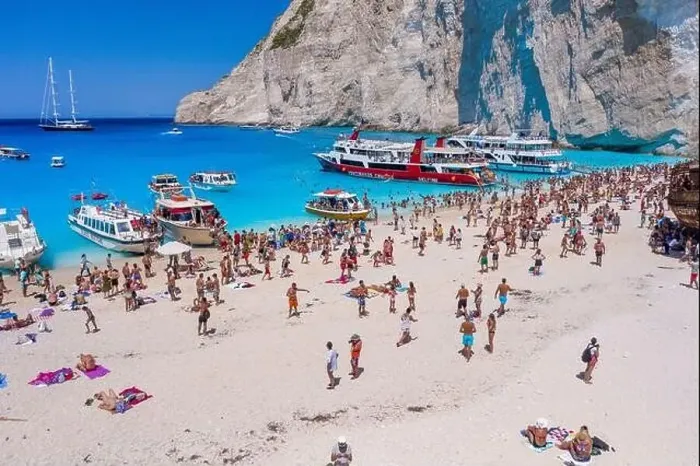 Framed Print : Zakynthos, Greece - August 20, 2019: Aerial drone shot of tourists on Zakynthos Shipwreck Navagio beach Framed Print : Zakynthos, Greece - August 20, 2019: Aerial drone shot of tourists on Zakynthos Shipwreck Navagio beach