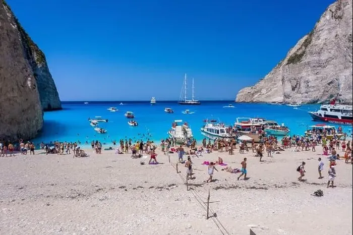 Framed Print : Zakynthos, Greece - August 20, 2019: Aerial drone shot of tourists on Zakynthos Shipwreck Navagio beach Framed Print : Zakynthos, Greece - August 20, 2019: Aerial drone shot of tourists on Zakynthos Shipwreck Navagio beach