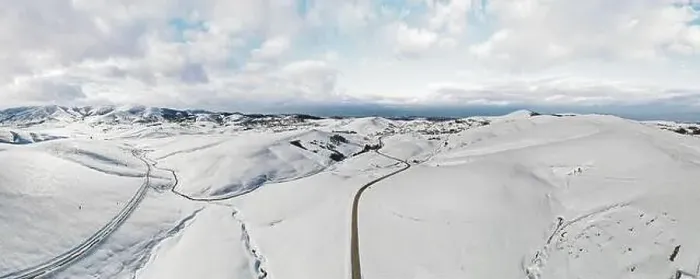 Framed Print : Zlatibor mountain in winter. Beautiful aerial rural landscape with curving road and hills in winter Framed Print : Zlatibor mountain in winter. Beautiful aerial rural landscape with curving road and hills in winter