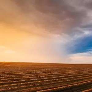 Aerial View Of Sunset Sunrise Bright Sky Above Summer Hay Field Landscape In Evening