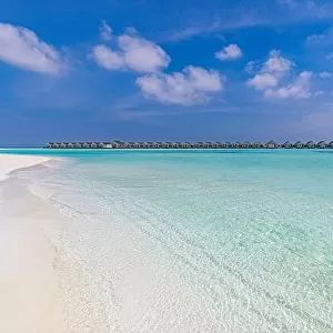 Amazing tropical Maldives resort hotel and island with beach sand and sea on sky for holiday vacation background concept. Soft sunrise light
