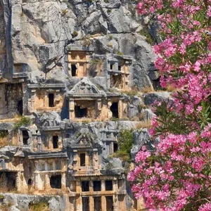 Ancient Lycian rock tombs and blooming oleander flowes, Myra (Demre), Turkey Ancient Lycian rock tombs and blooming oleander flowes, Myra (Demre), Turkey