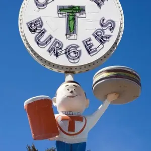 Circle T Burgers Sign and Boy outside a drive-in in Belen New Mexico Circle T Burgers Sign and Boy outside a drive-in in Belen New Mexico
