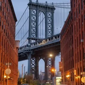 Cityscape of Manhattan Bridge from Brooklyn in New York City at twilight